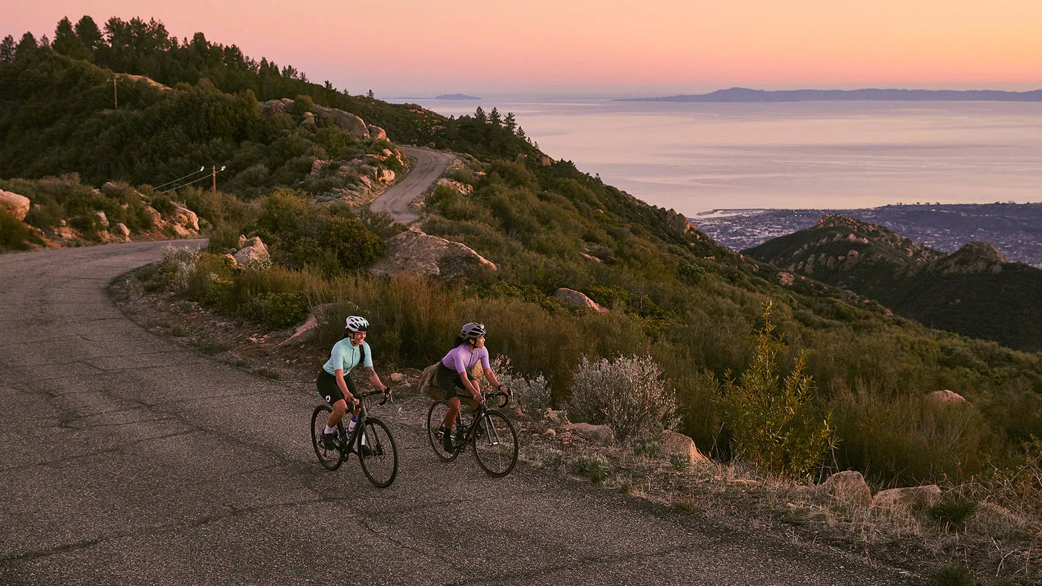 Two riders on a mountain road