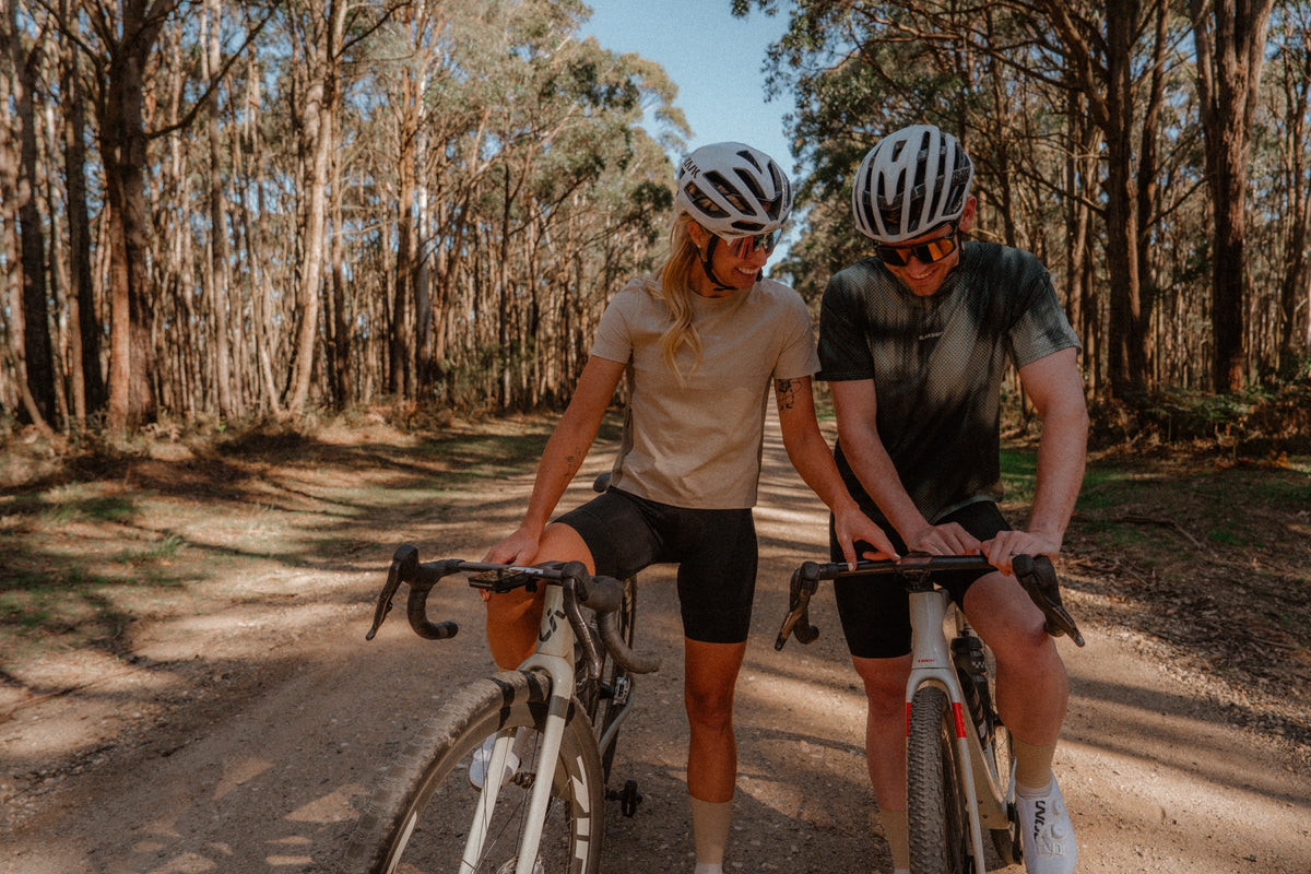 Riders in the Enduro Tee on a gravel road